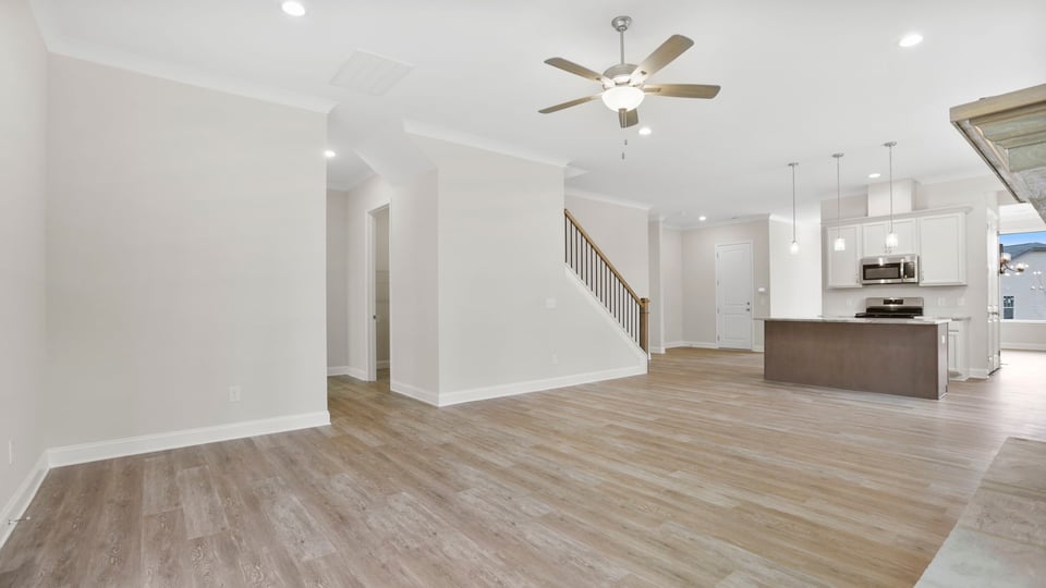 Living area with fireplace and windows.