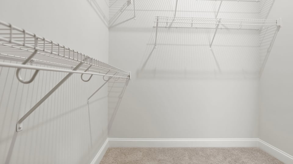 Primary closet with shelf.