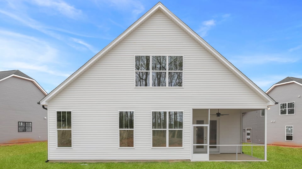 Back exterior with large backyard.