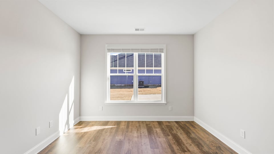 Bedroom with window and closet.