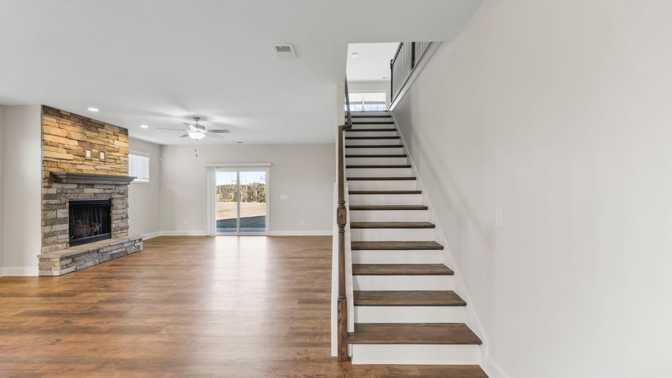 Living area with stairs to second level.