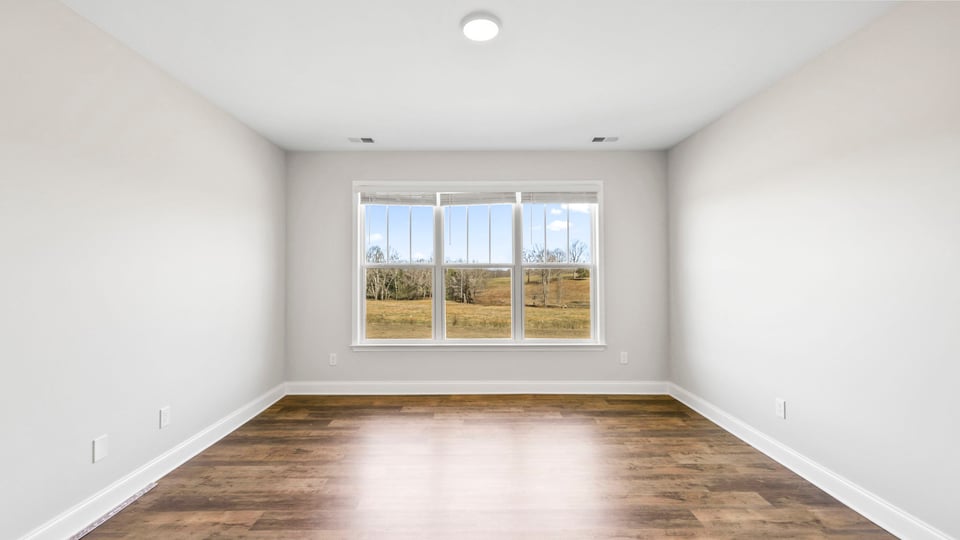 Loft area with large window.