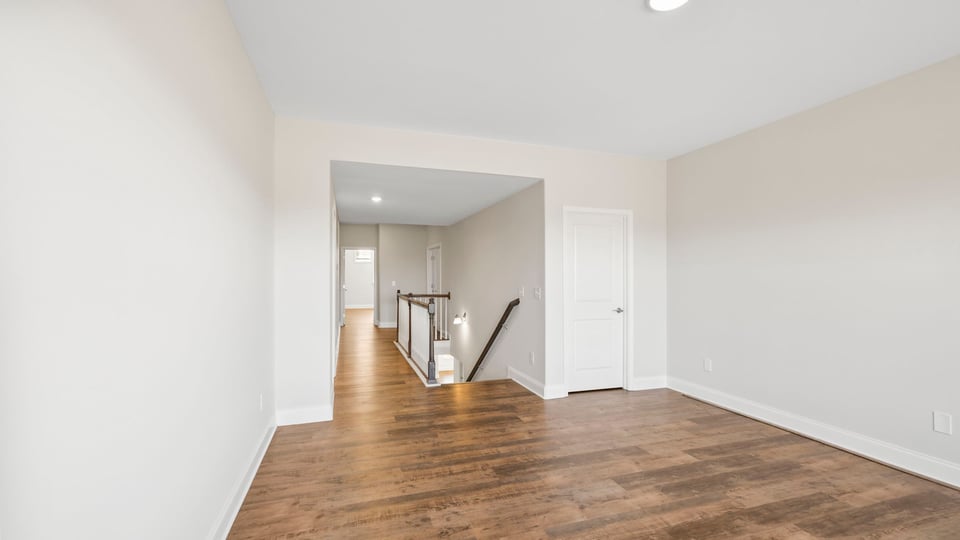 Loft area with large window.