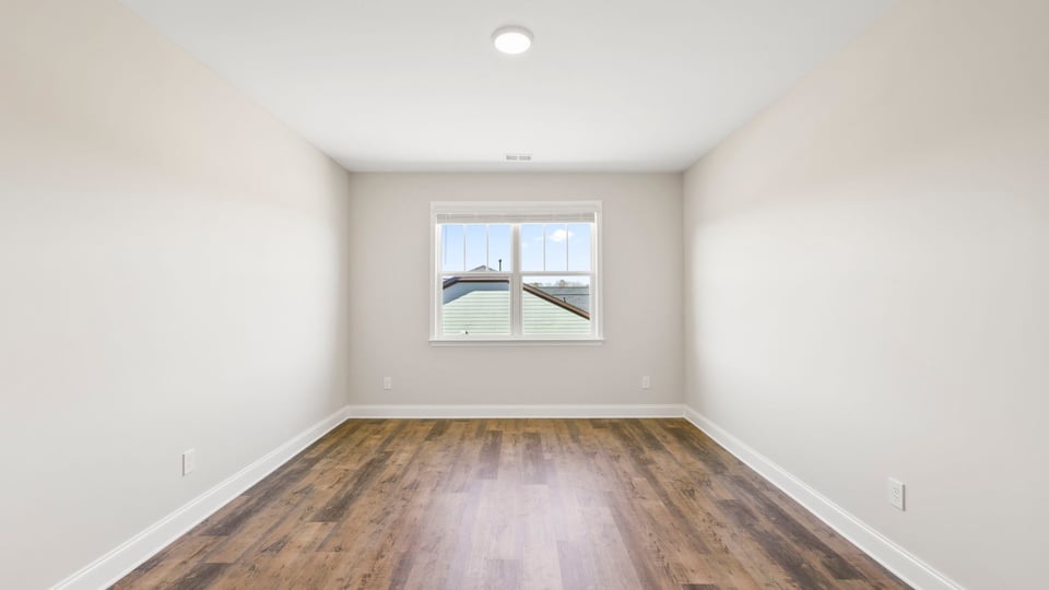 Bedroom with window and closet.
