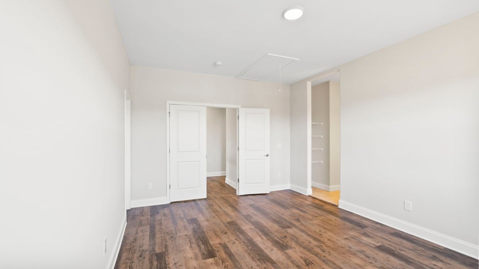 Bedroom with window and closet.