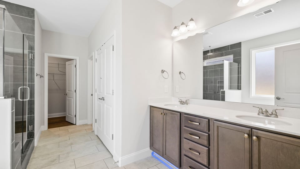 Primary bathroom with double vanity sinks.
