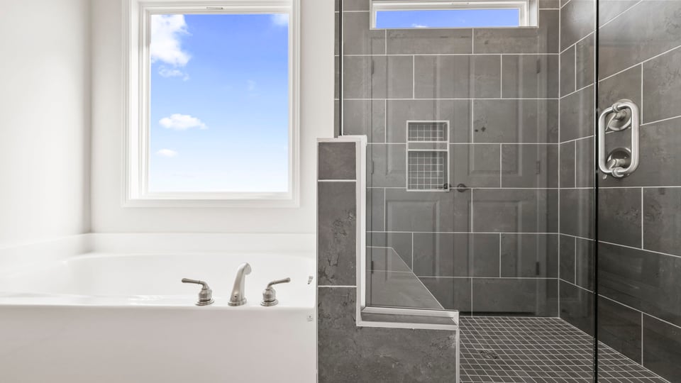 Primary bathroom with double vanity sinks.