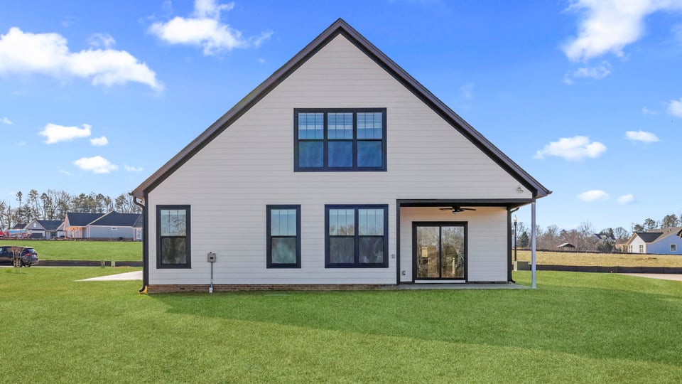 Back exterior with large backyard.