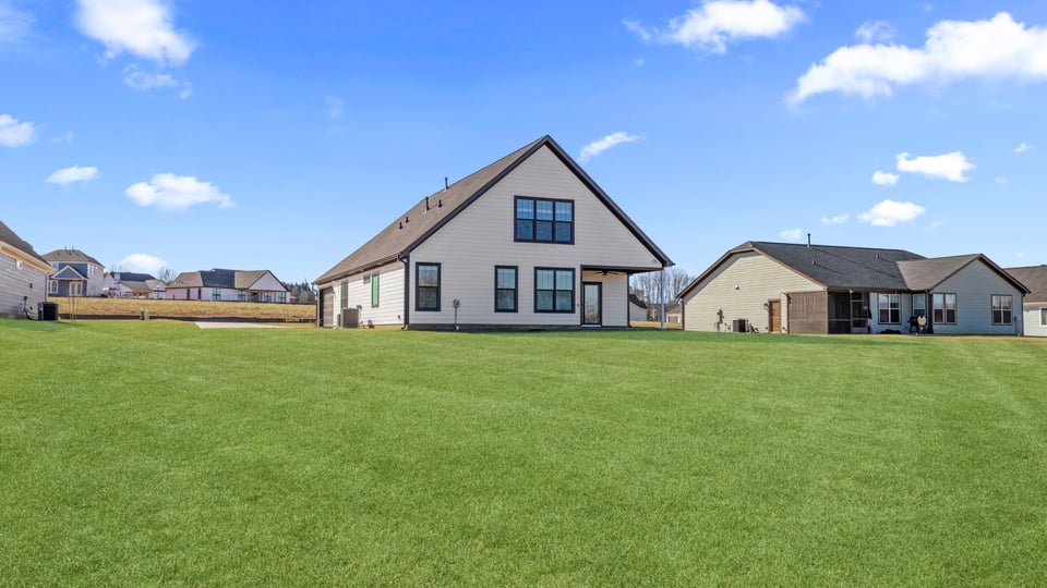 Back exterior with large backyard.