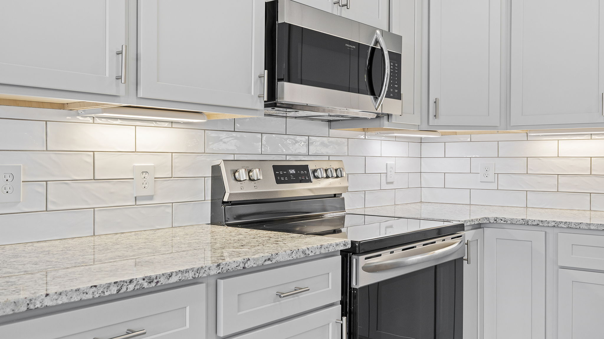 Kitchen with island and cabinets.
