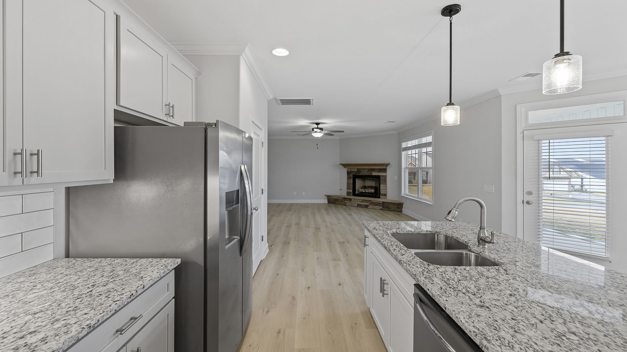 Kitchen with island and cabinets.