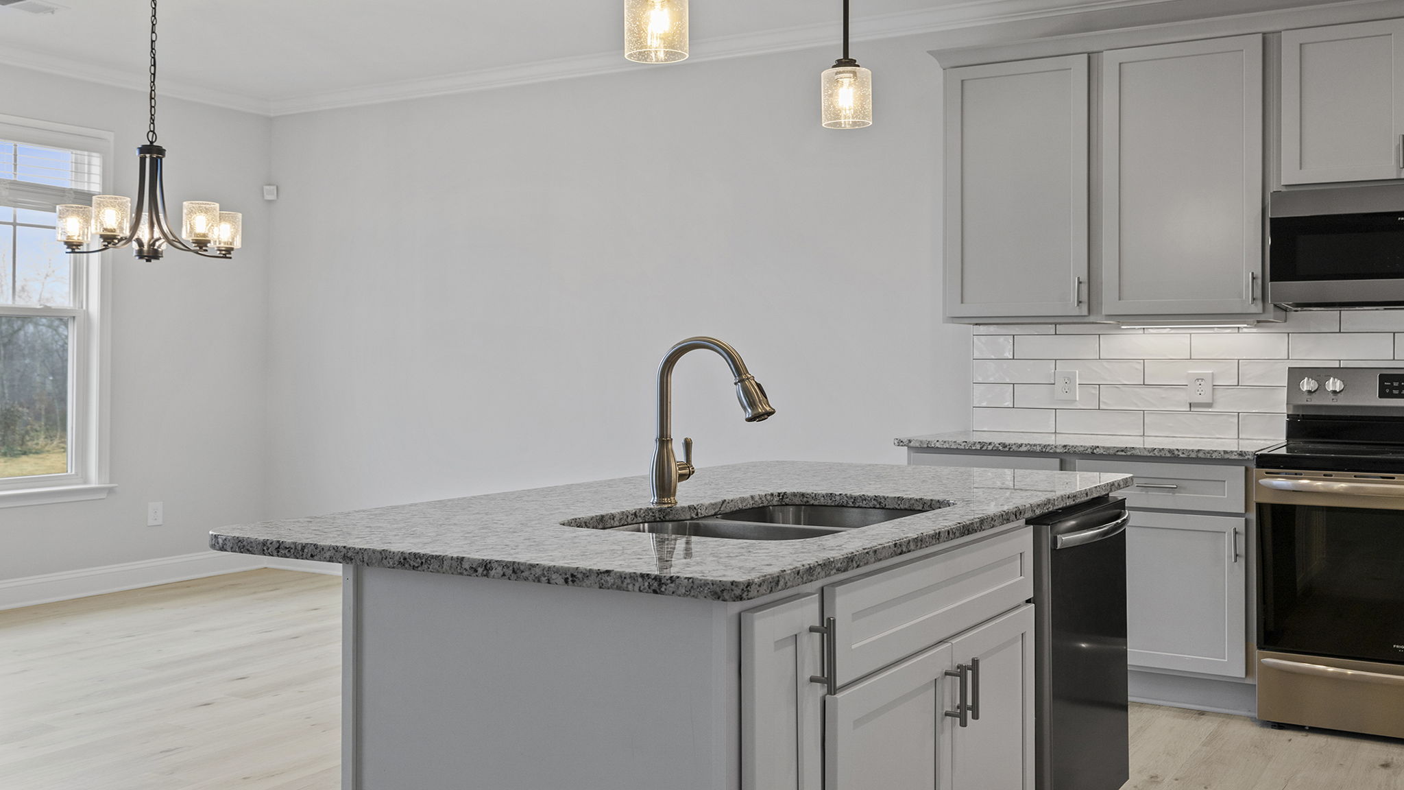 Kitchen with island and cabinets.