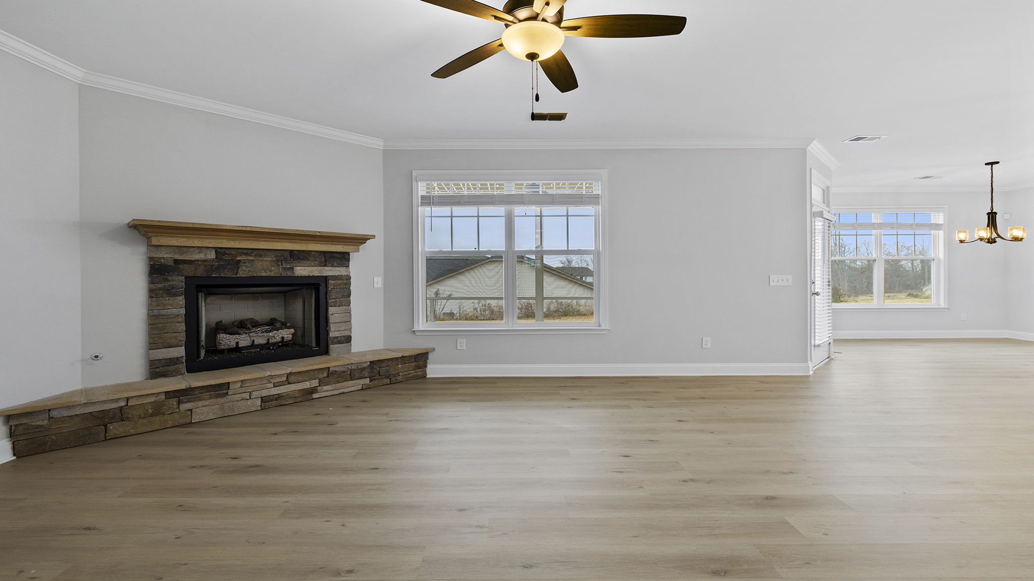 Living area with fireplace and windows.