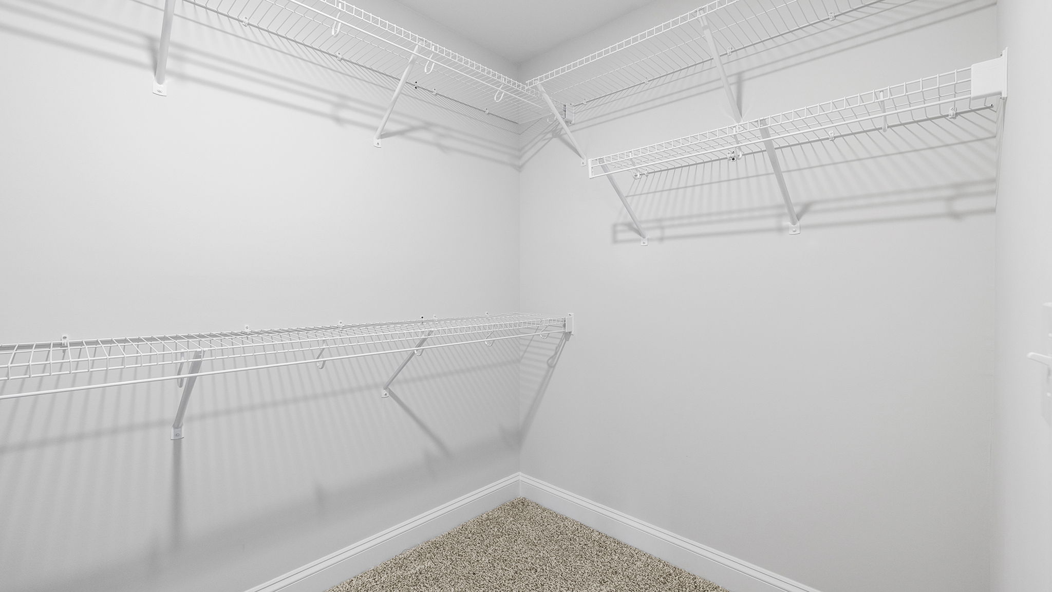 Primary closet with shelf.