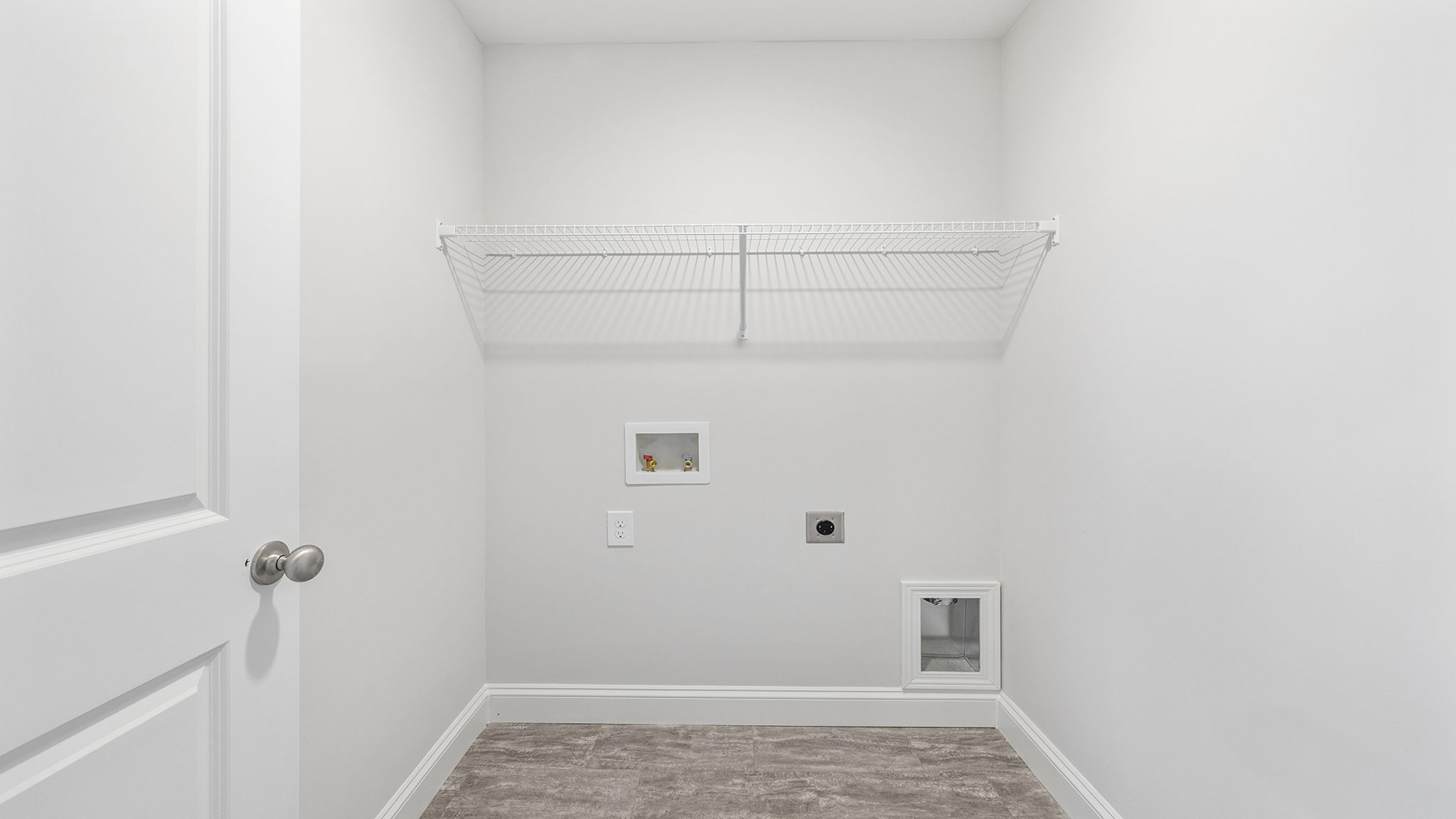 Laundry room with shelf.