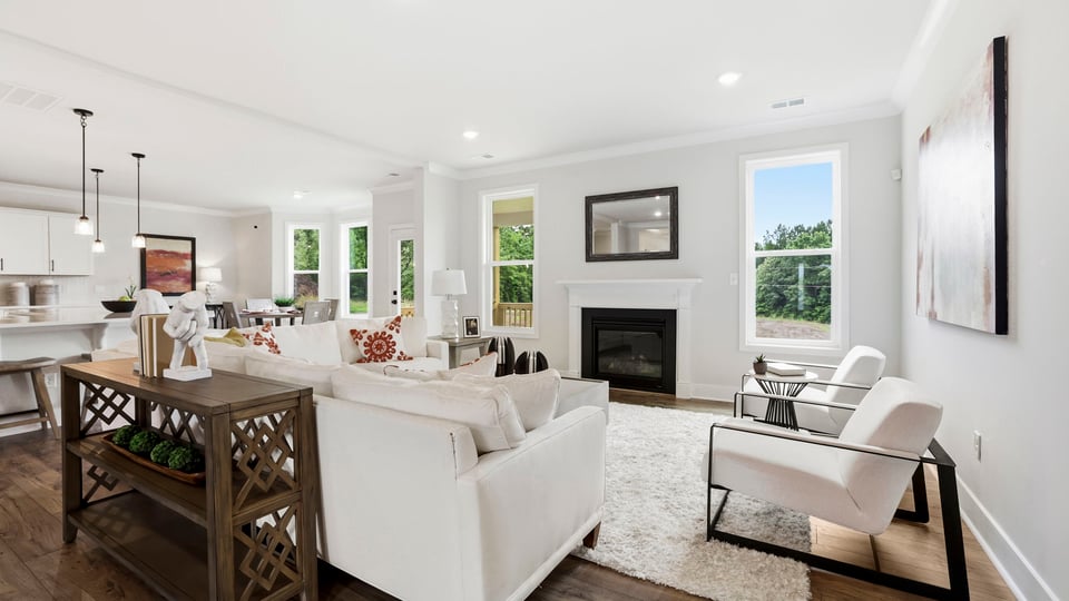 Living area with windows and fireplace.