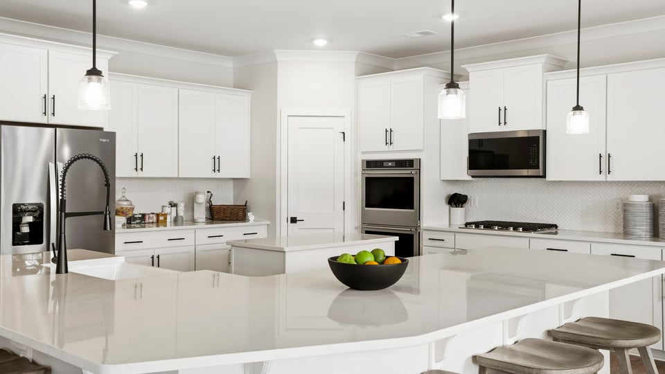 Kitchen with island and cabinets.