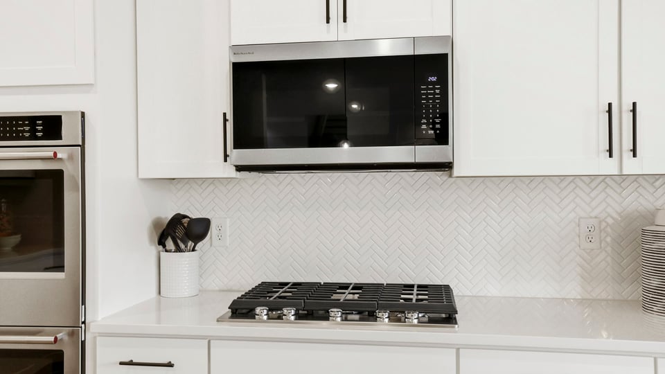 Kitchen with island and cabinets.