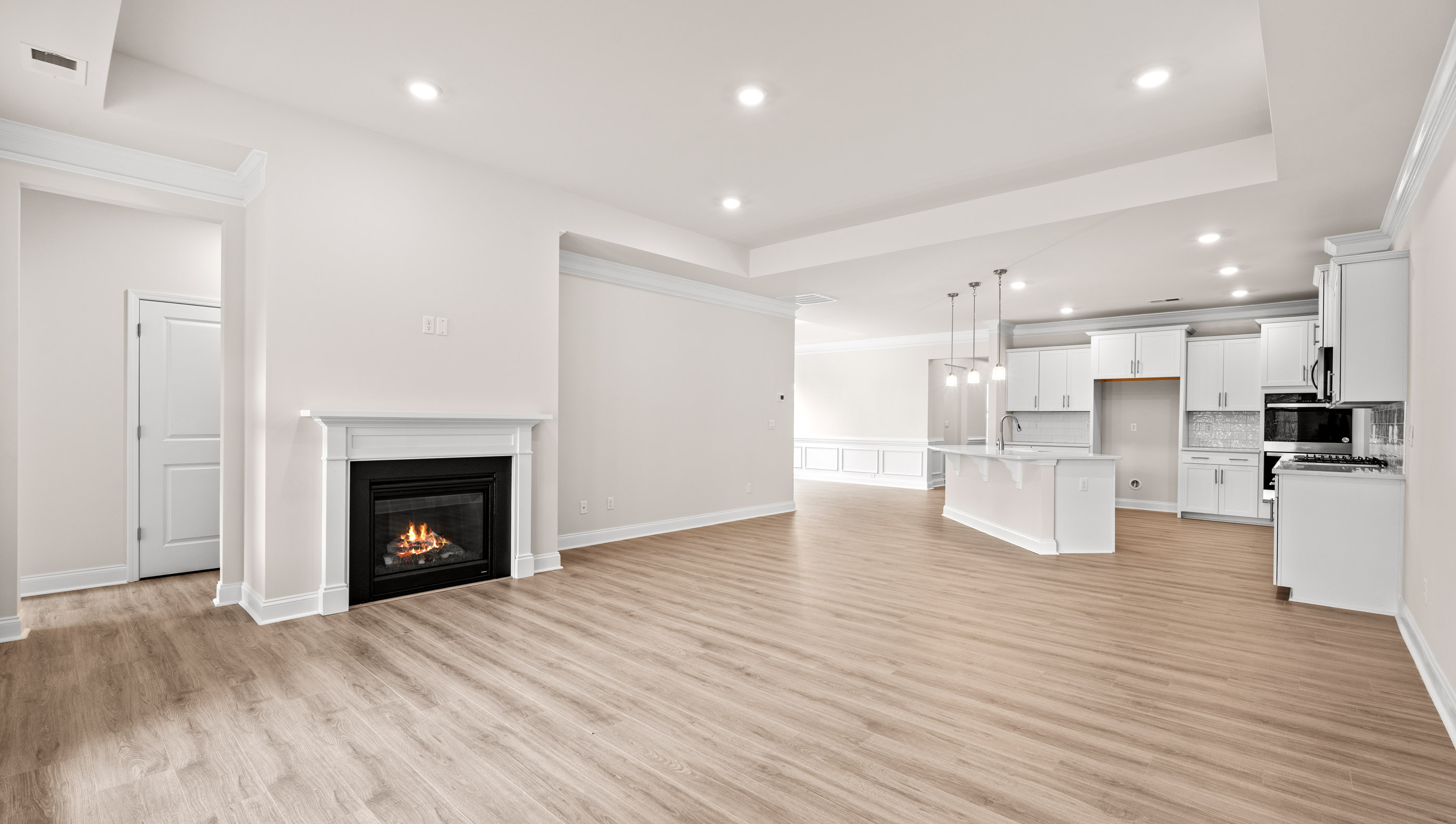Living area with windows and fireplace.