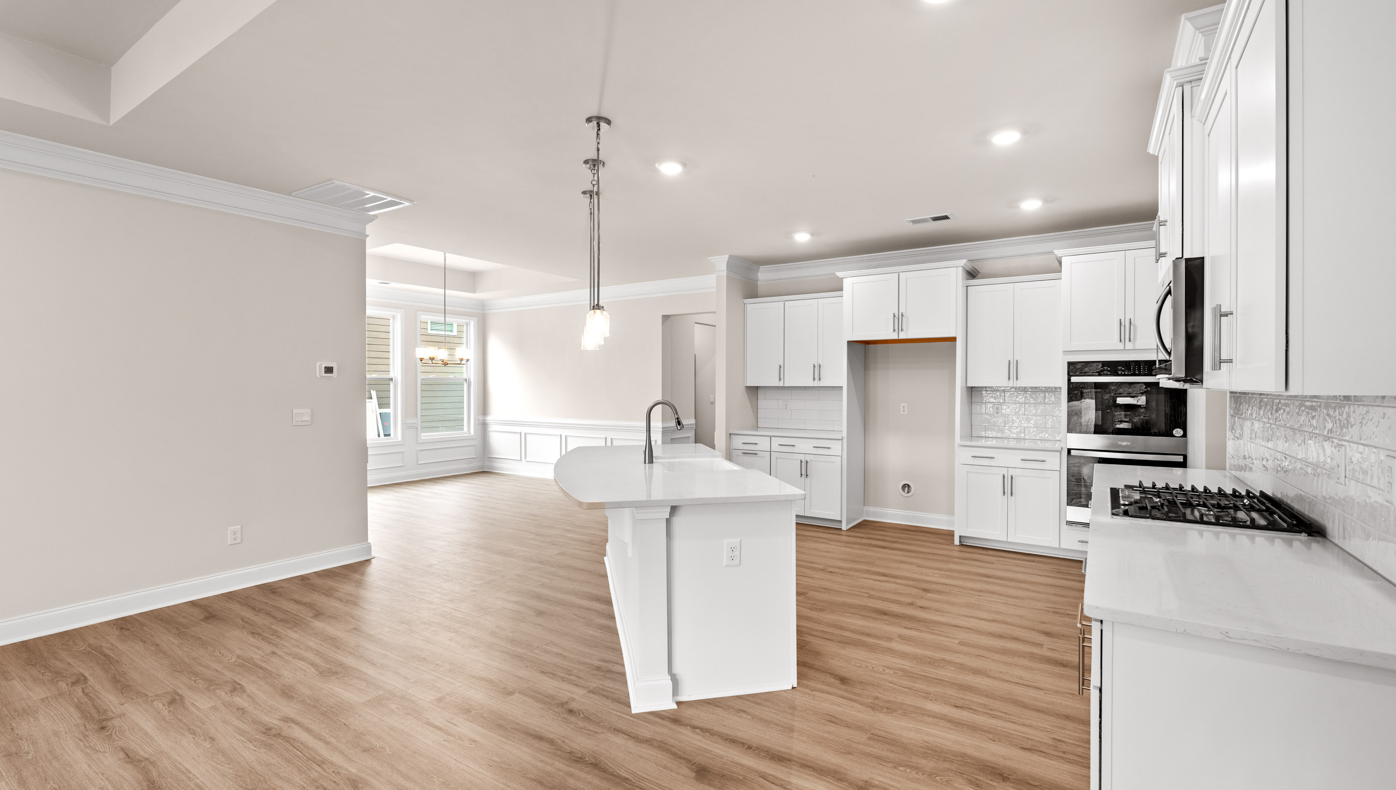 Kitchen with island and cabinets.