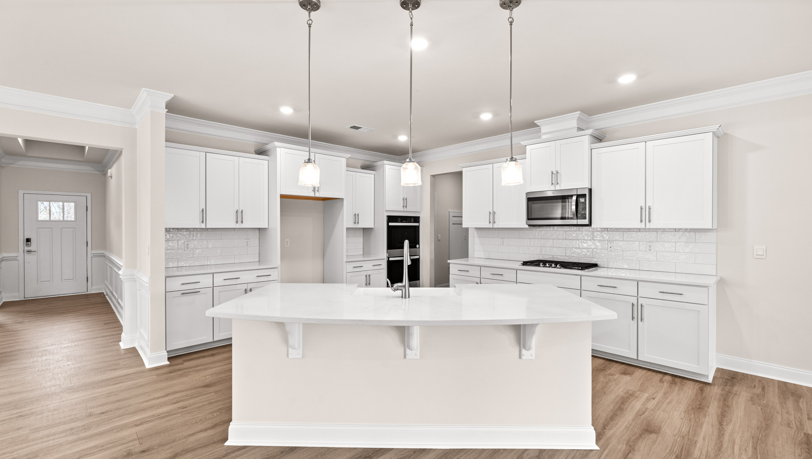 Kitchen with island and cabinets.