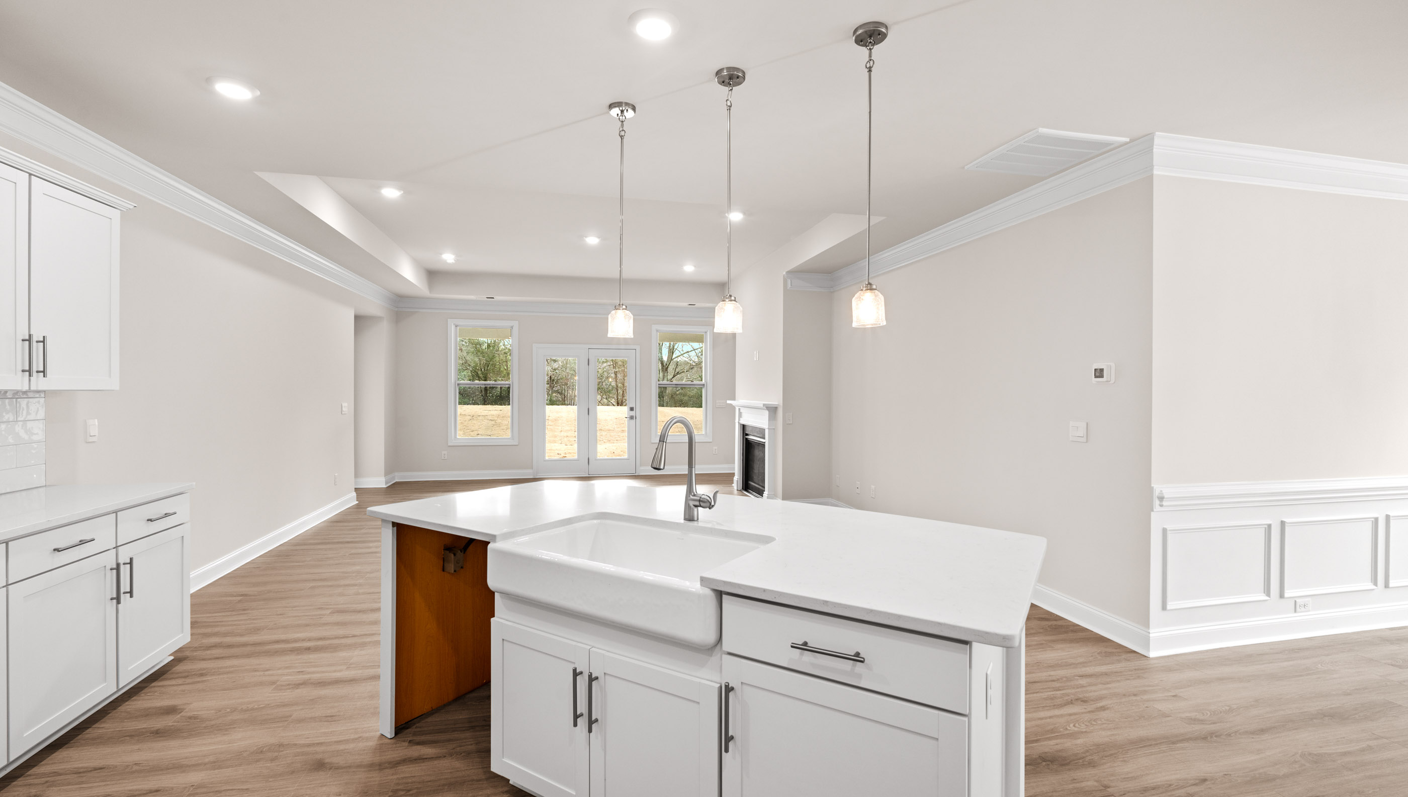 Kitchen with island and cabinets.