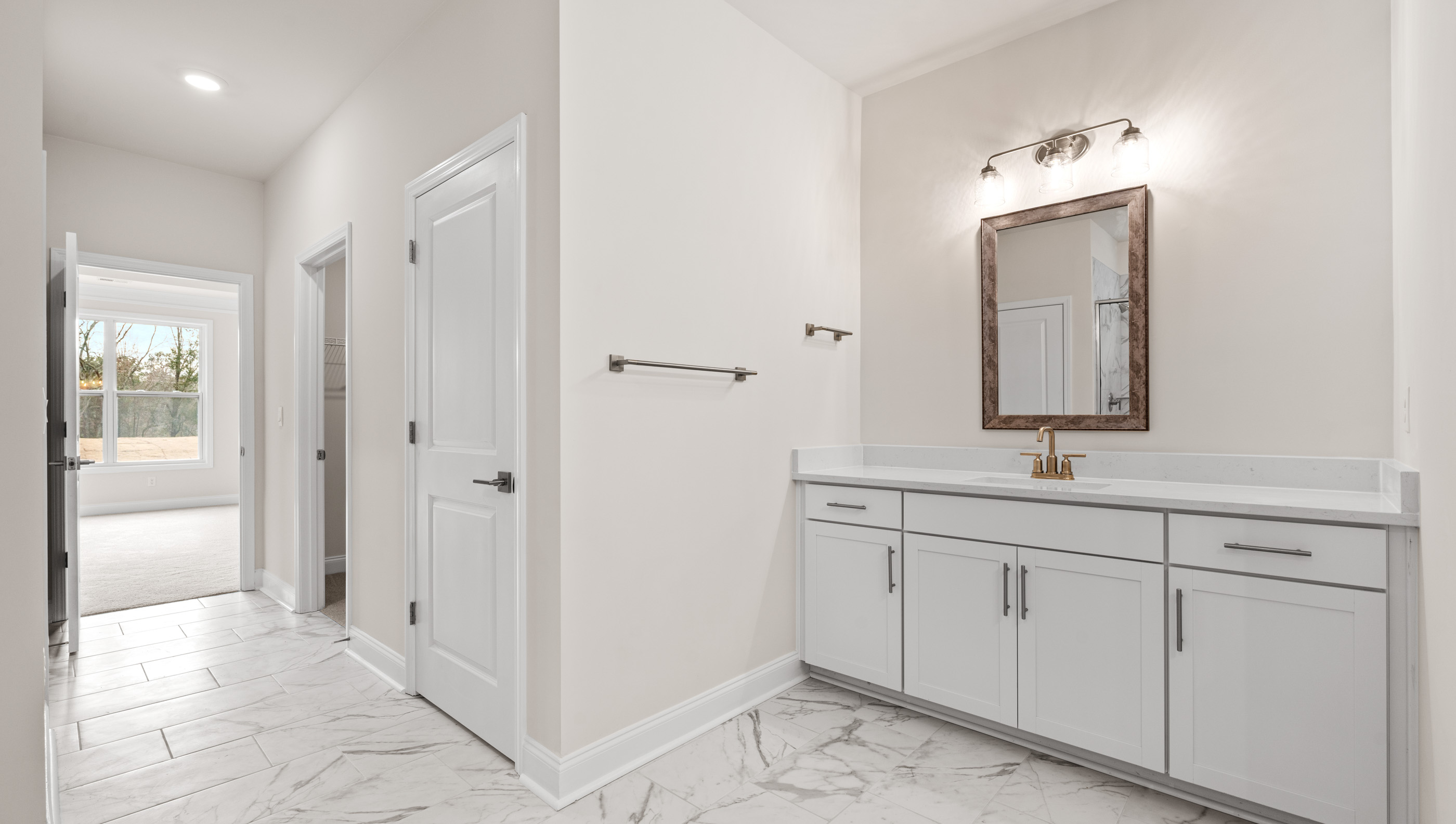 Primary bathroom with double vanity sinks.