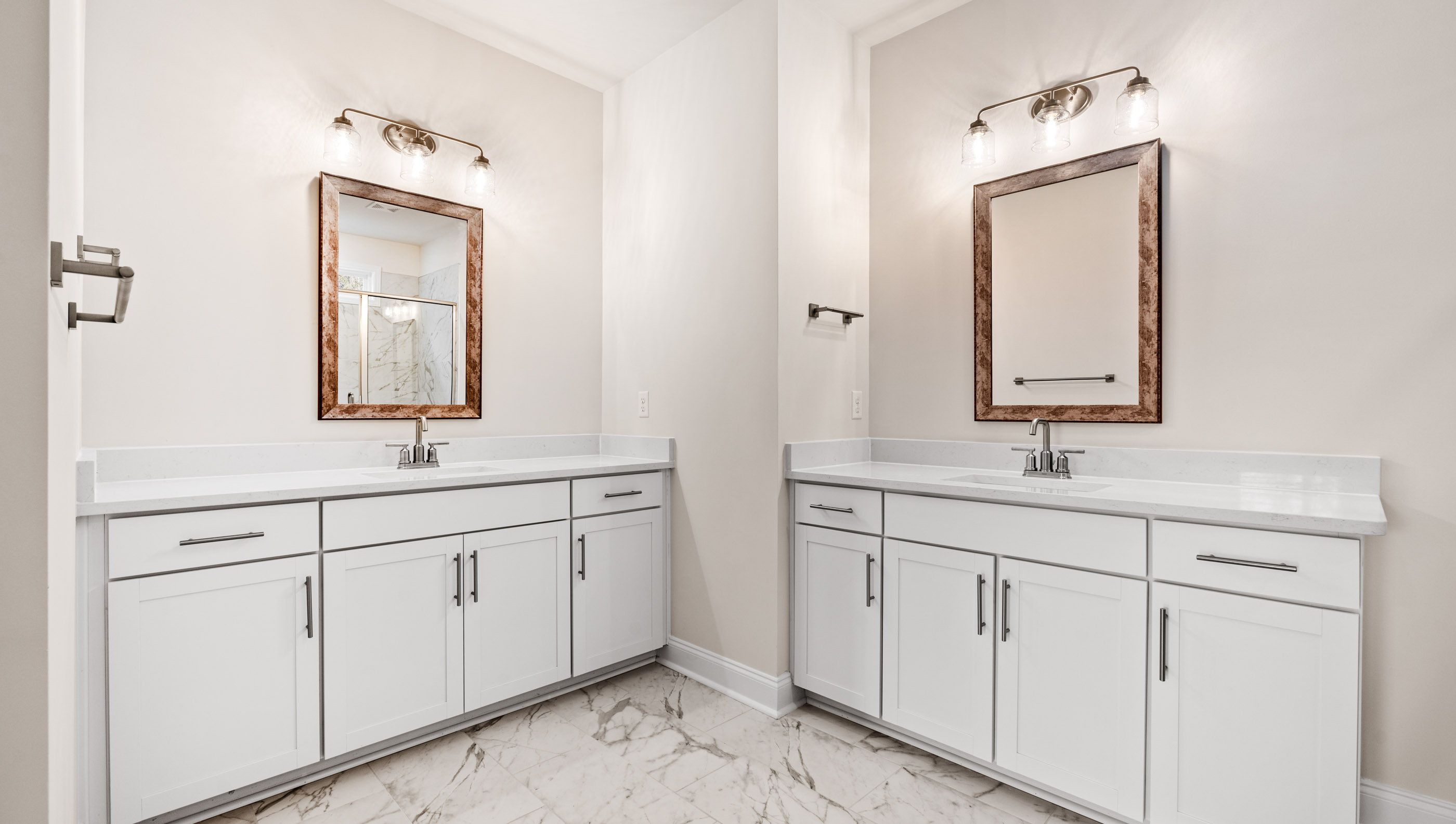 Primary bathroom with double vanity sinks.