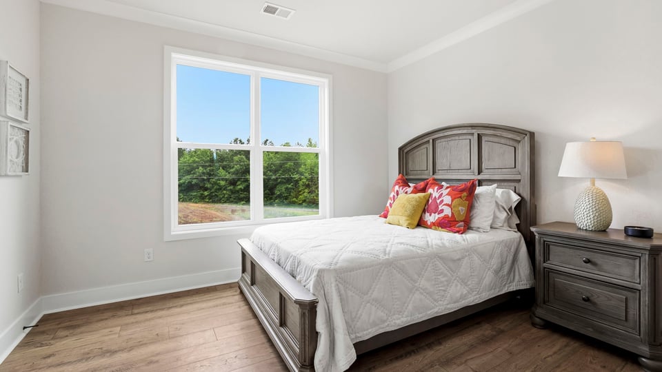 Bedroom with window and closet.