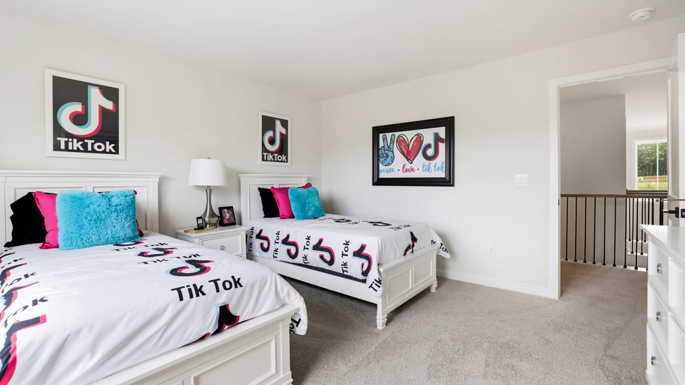 Bedroom with carpet and window.