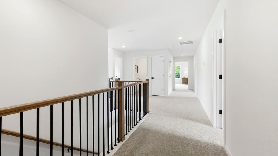 Top of stairs with carpet.