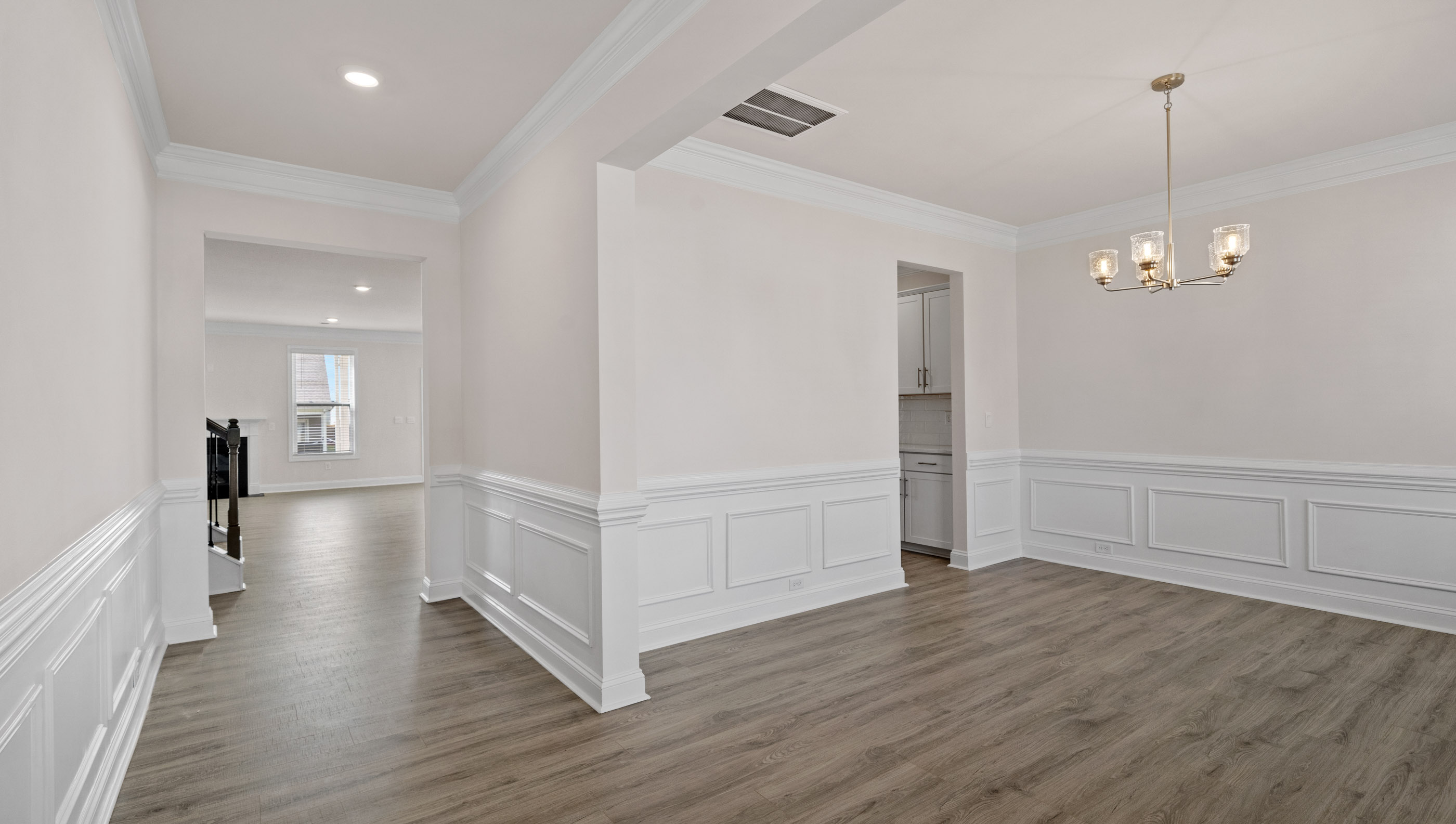 View of large hallway toward the living area and dining room.