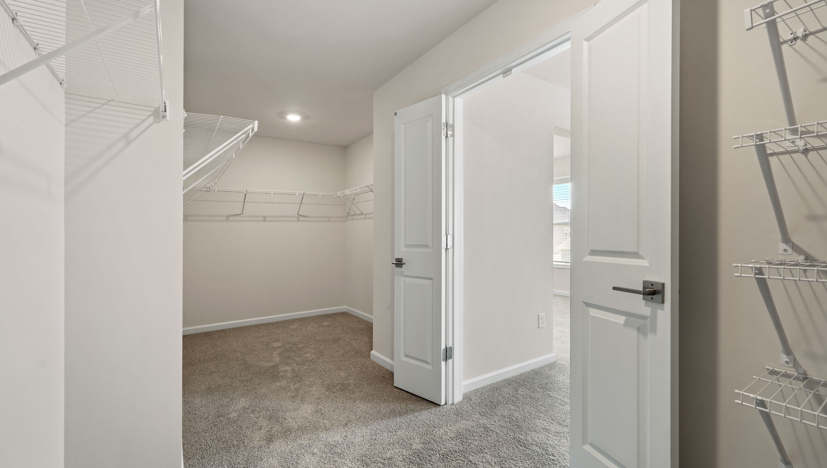 Primary bedroom walk-in closet.