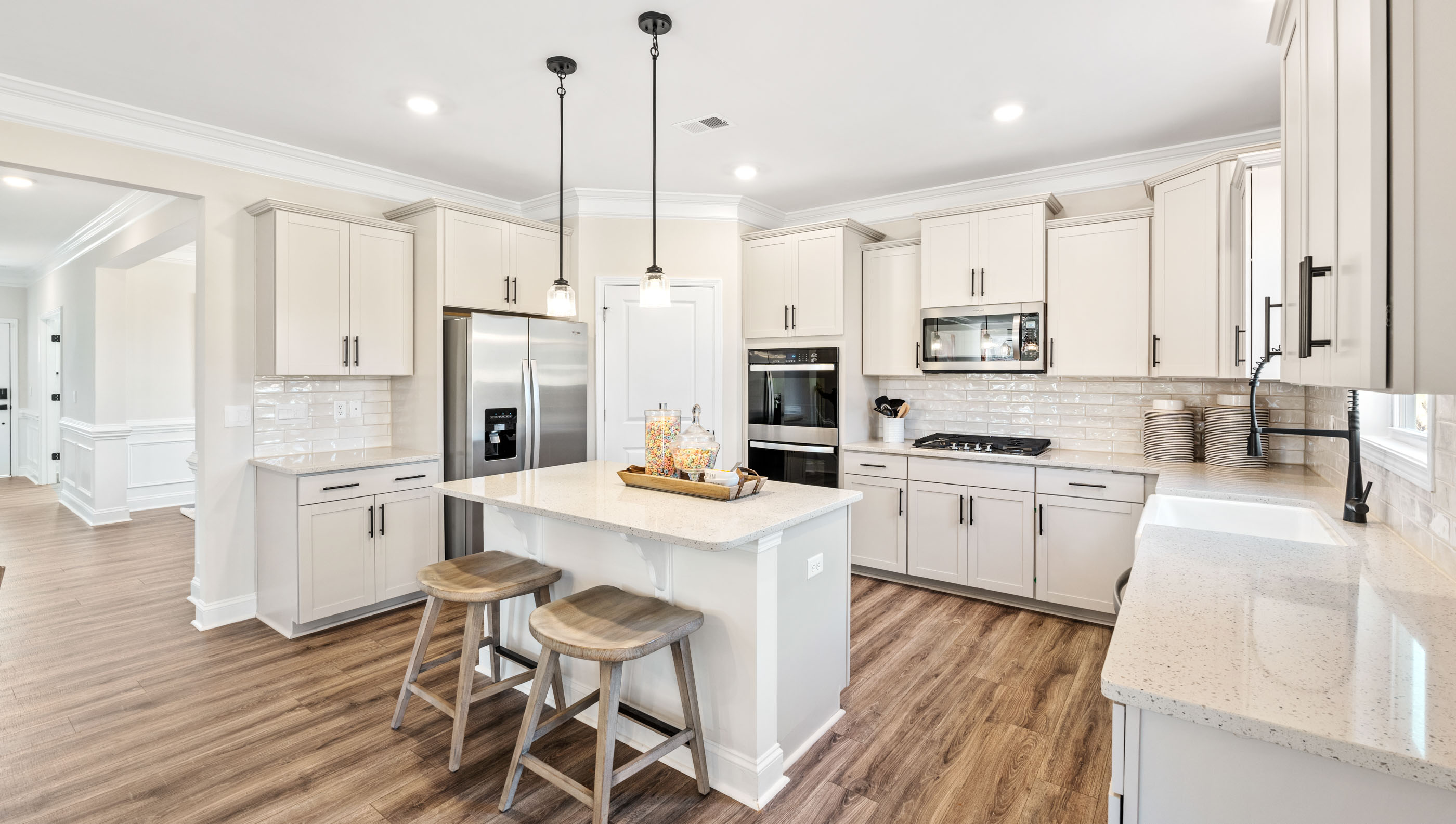 Kitchen with island and cabinets.