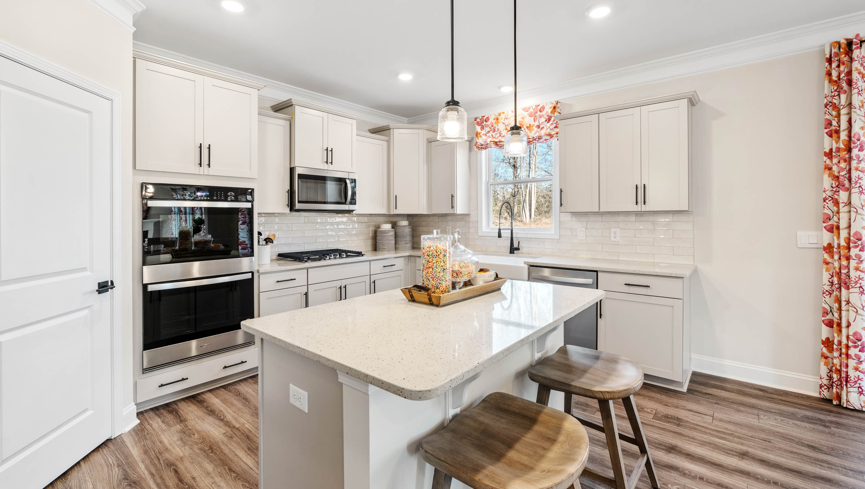 Kitchen with island and cabinets.