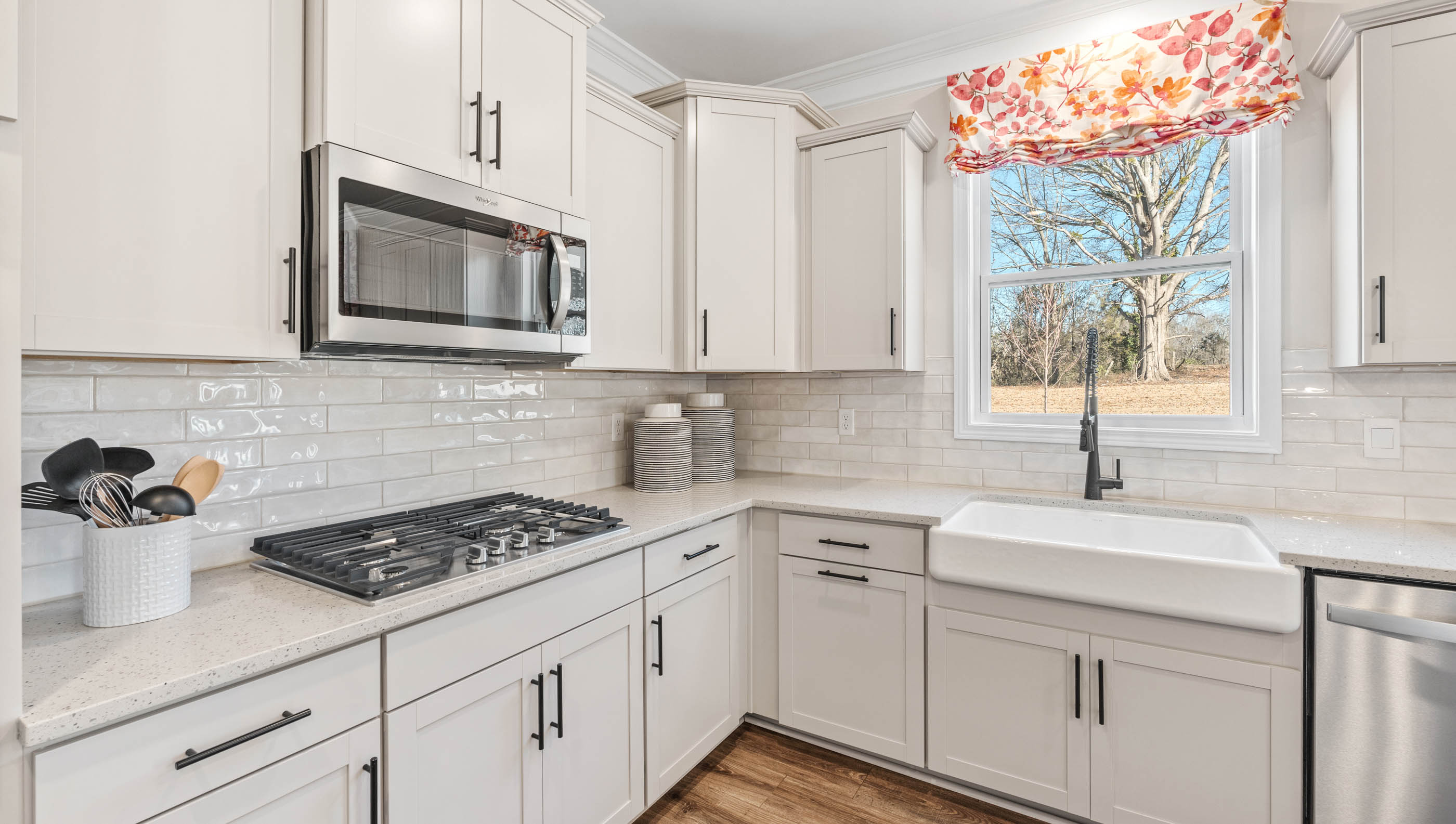 Kitchen with island and cabinets.