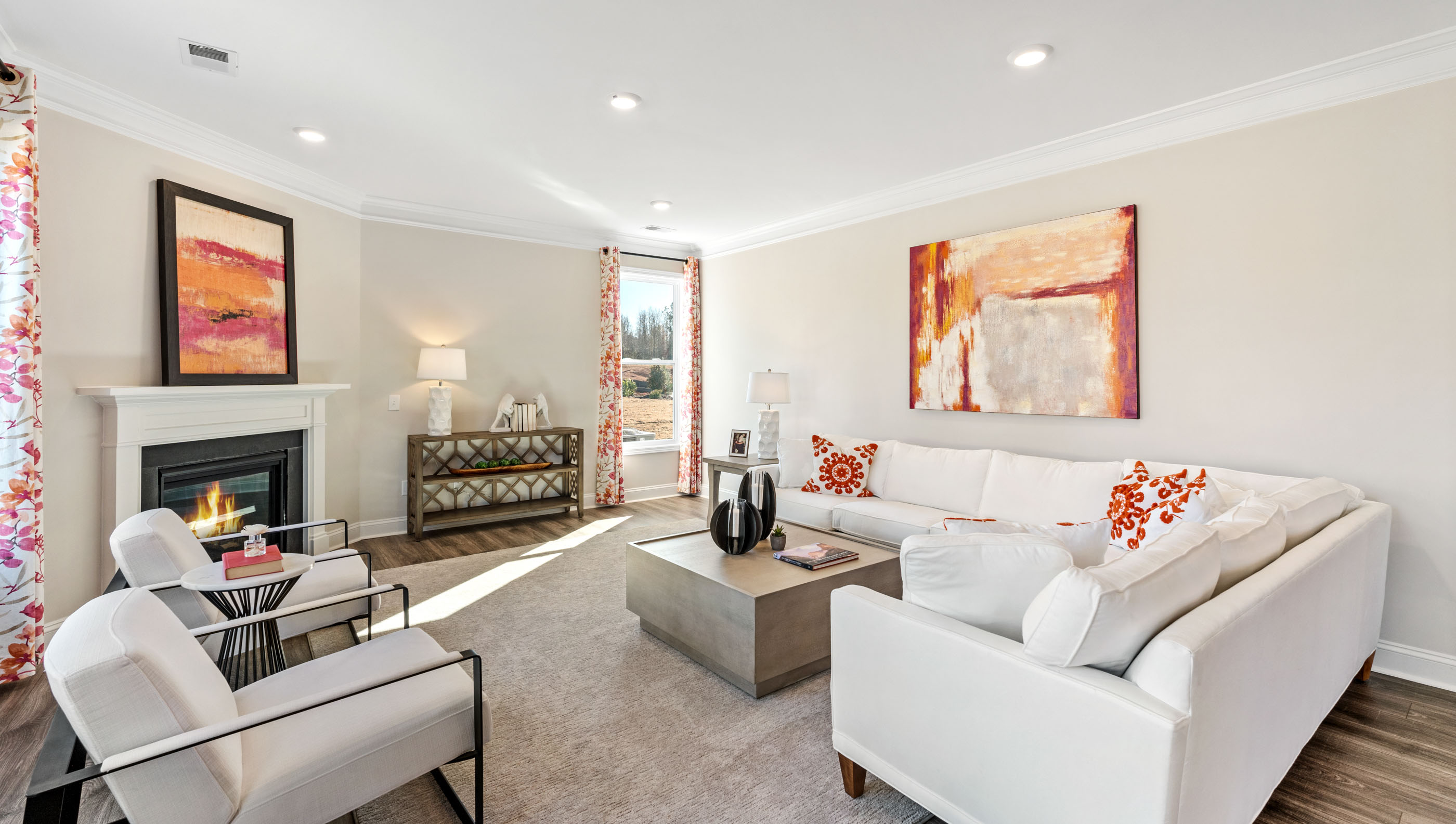 Living area with windows and fireplace.