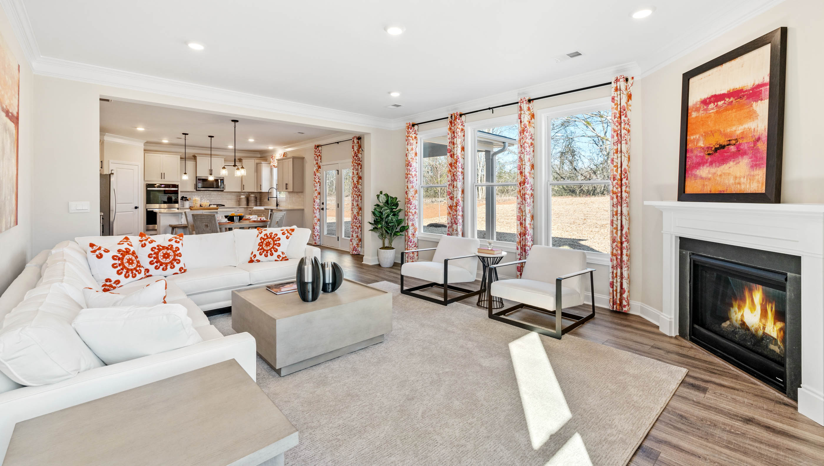 Living area with windows and fireplace.