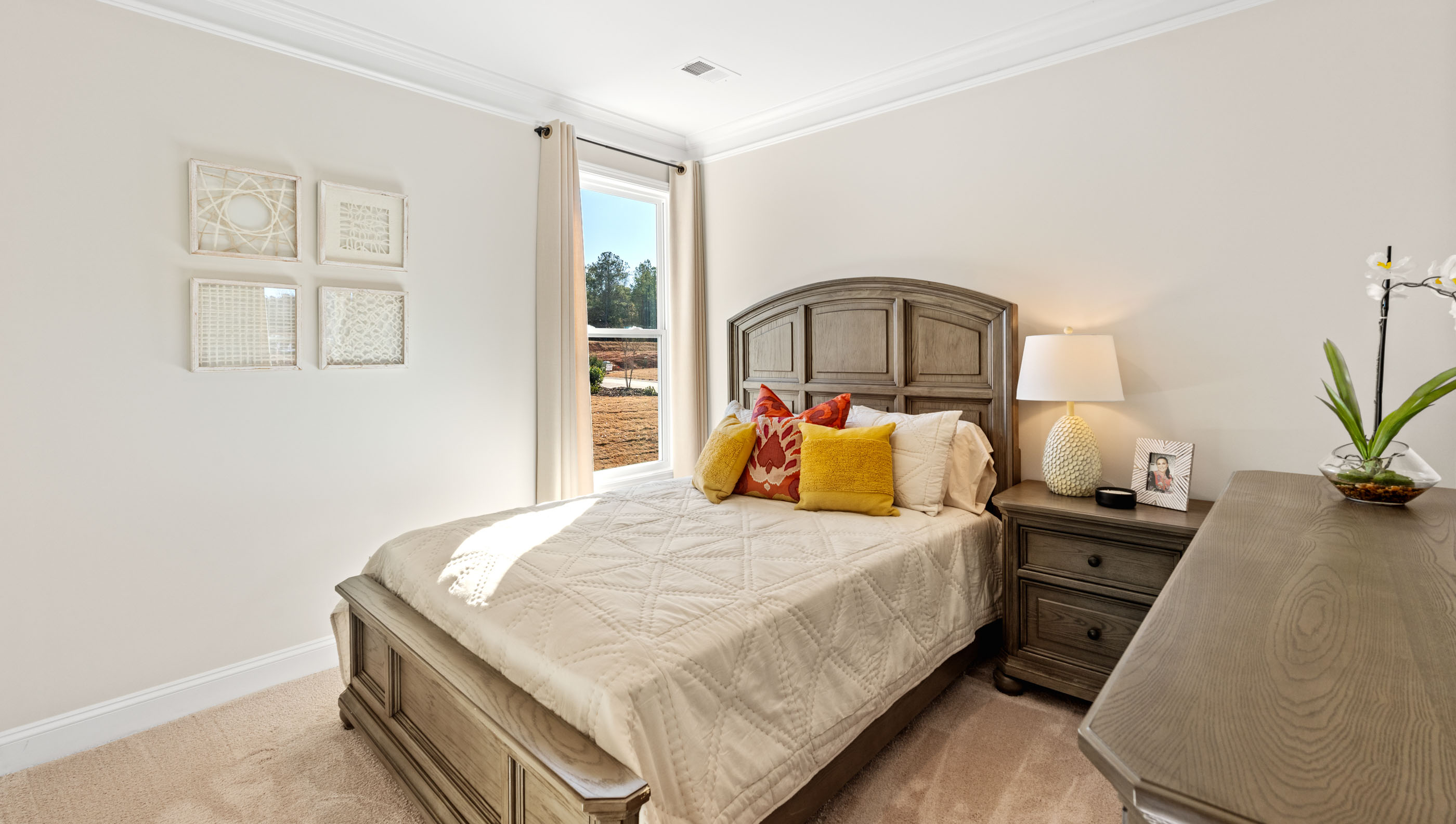 Bedroom with window and carpet.