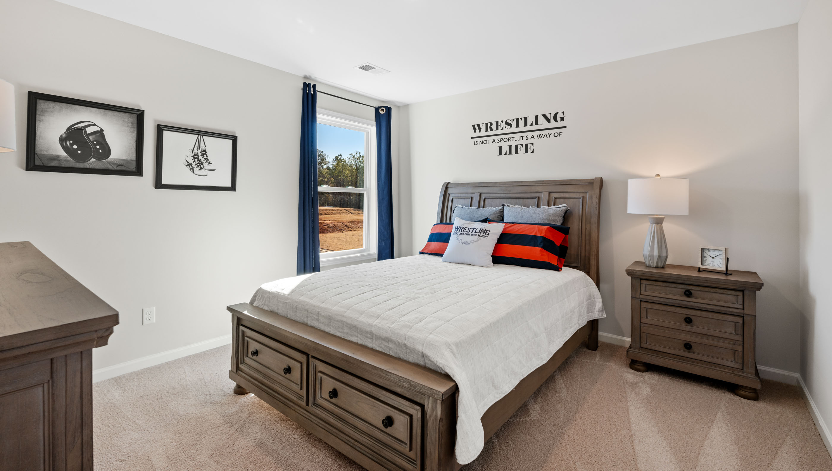 Bedroom with window and carpet.