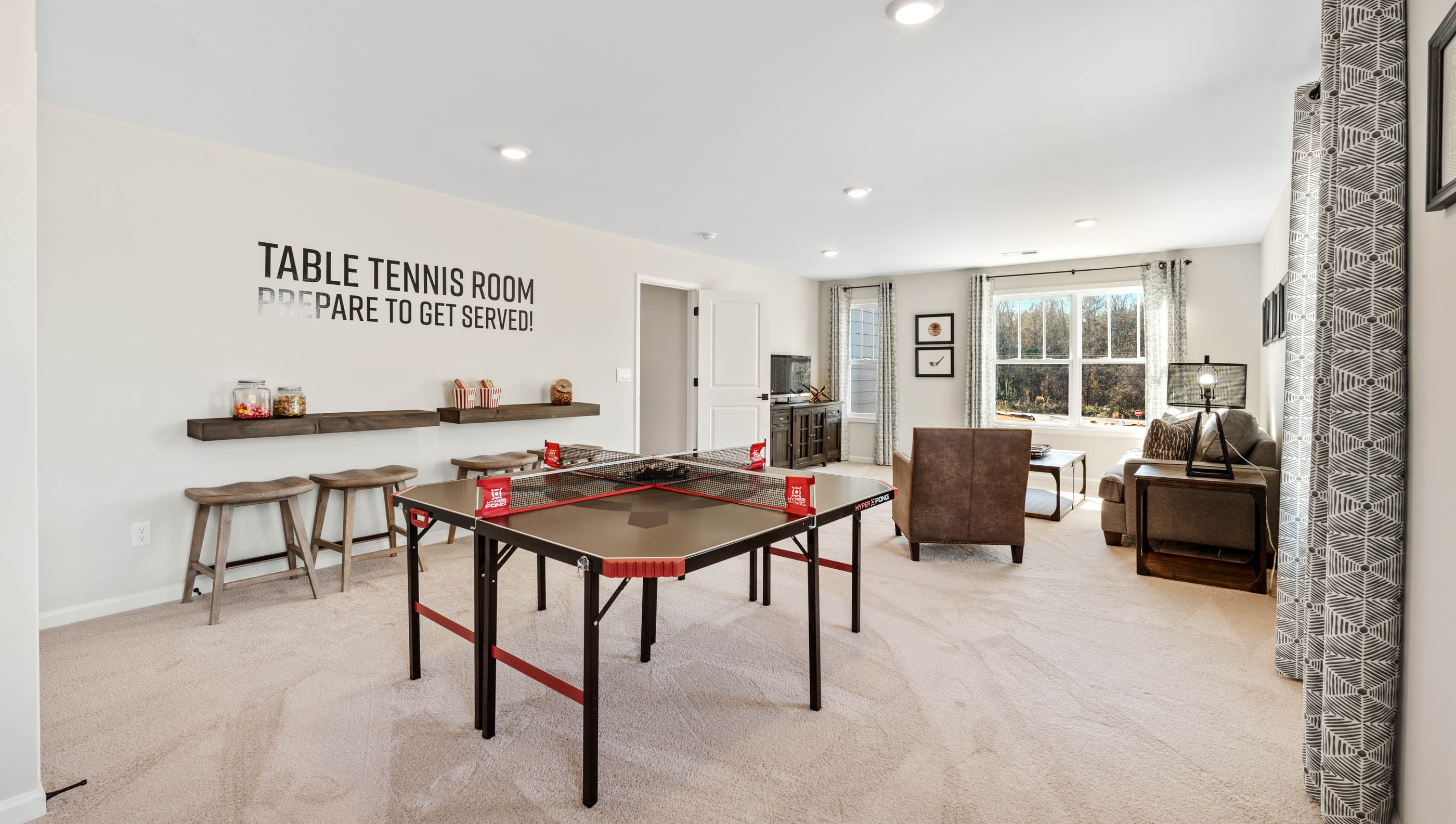 Loft area with carpet and windows.