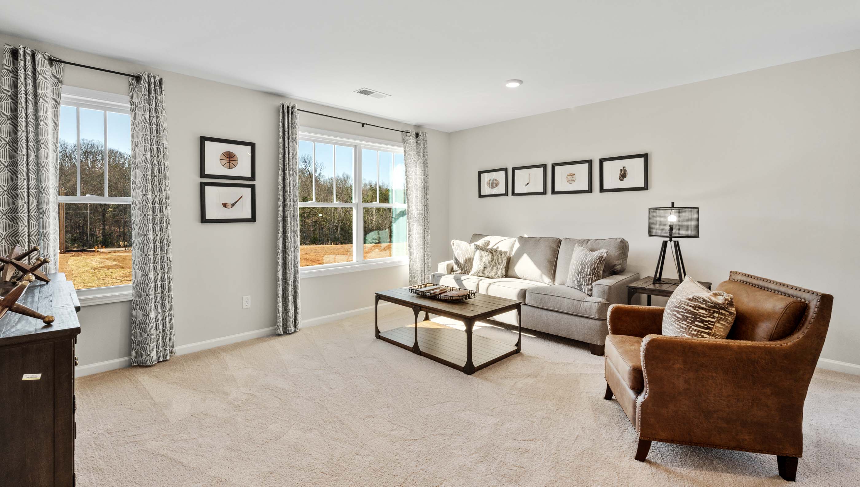 Loft area with carpet and windows.