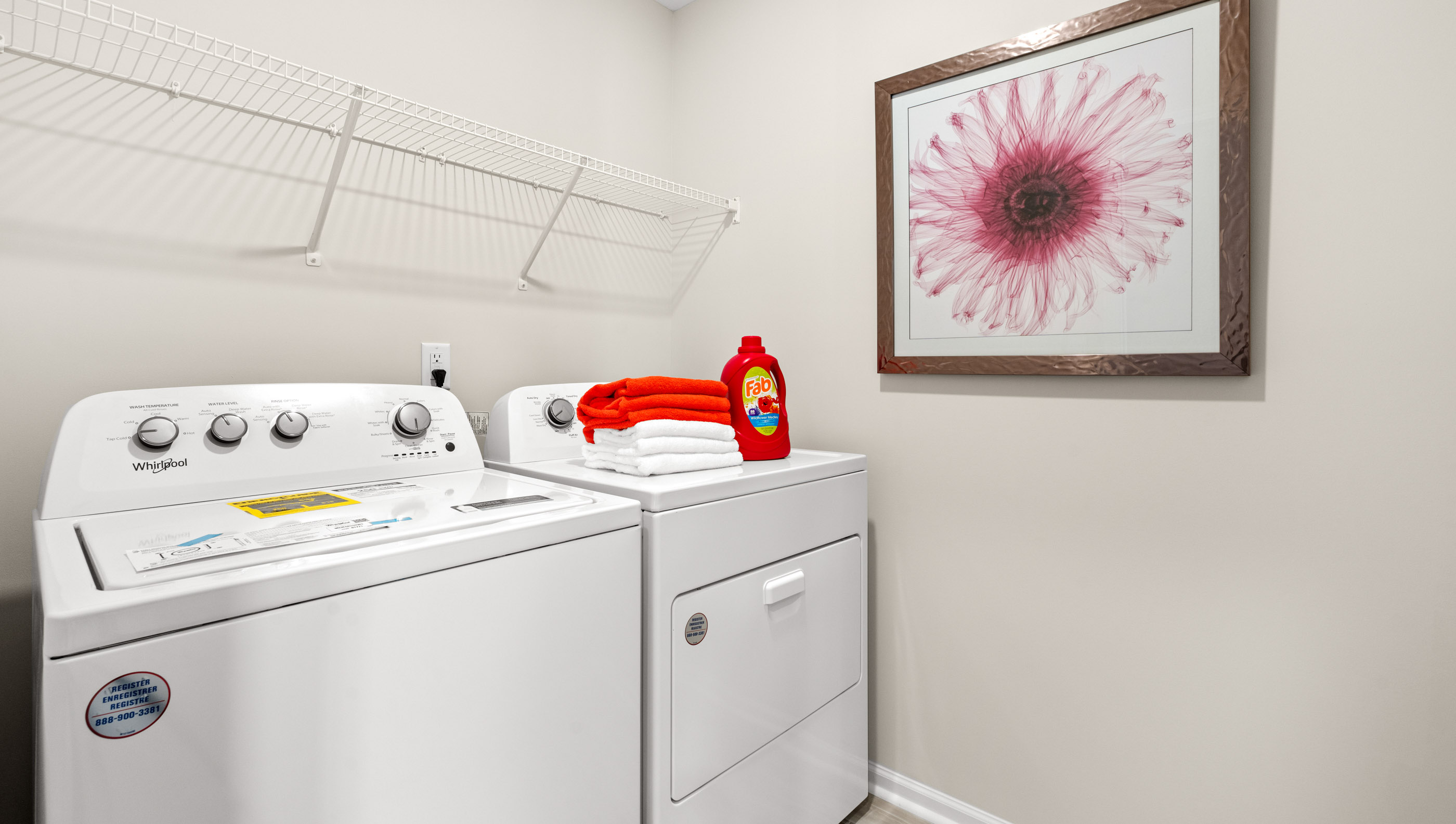 Laundry room with shelf.