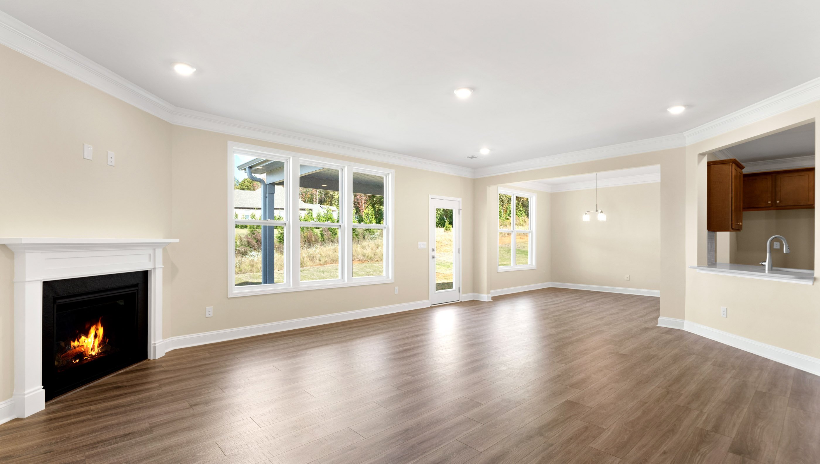 View of family room and breakfast area with lots of windows.