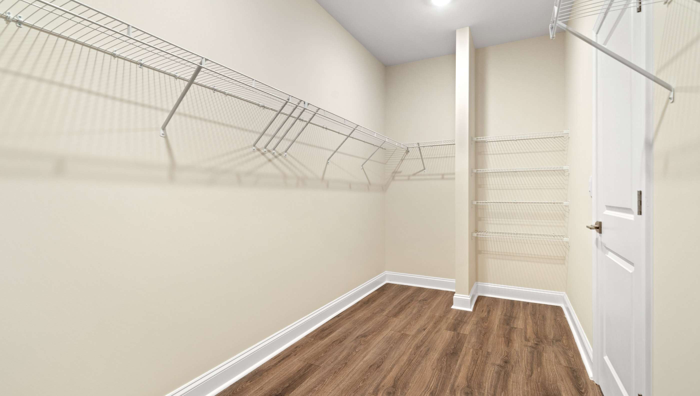 Primary bedroom walk-in closet.