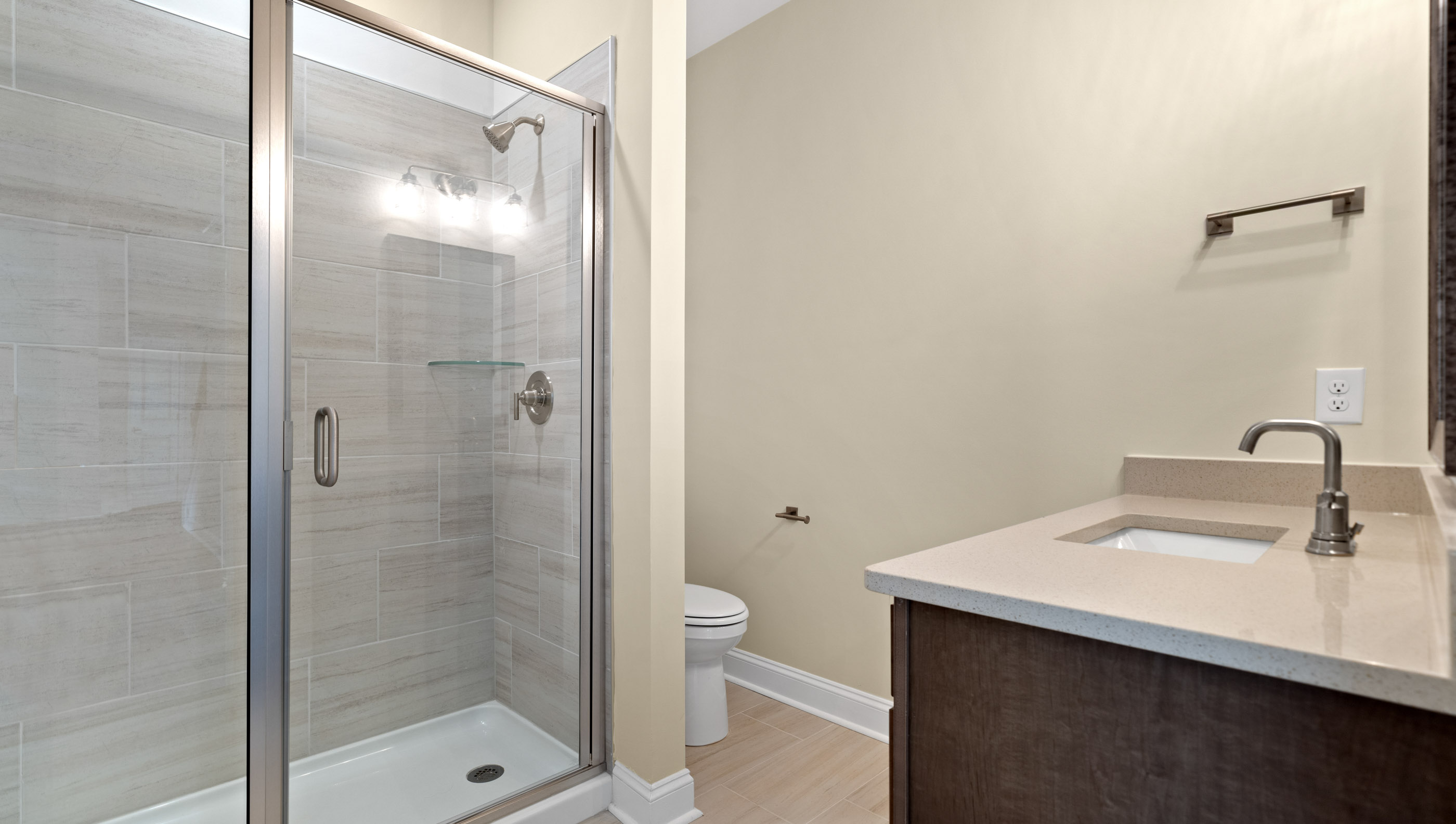 Hall bathroom with walk-in shower.
