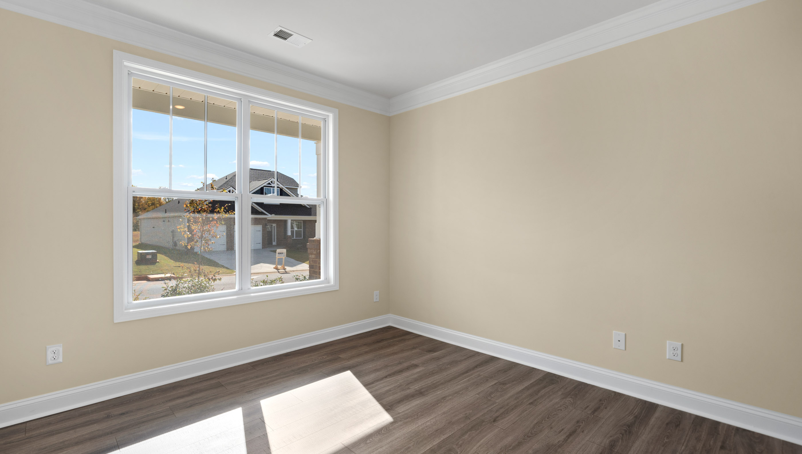 Bedroom on the main level with large window.