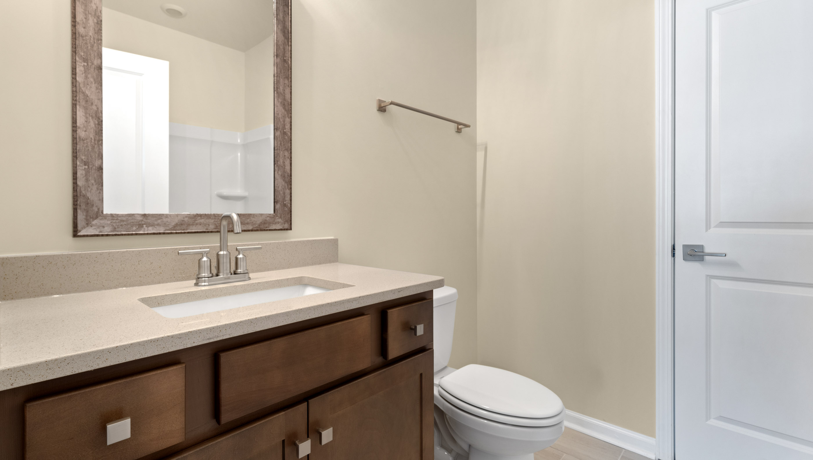 Upper level bathroom with vanity and combination shower / tub.