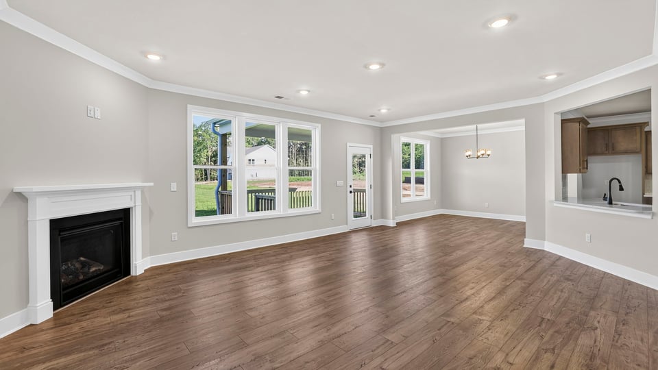 Family room with fireplace and window.