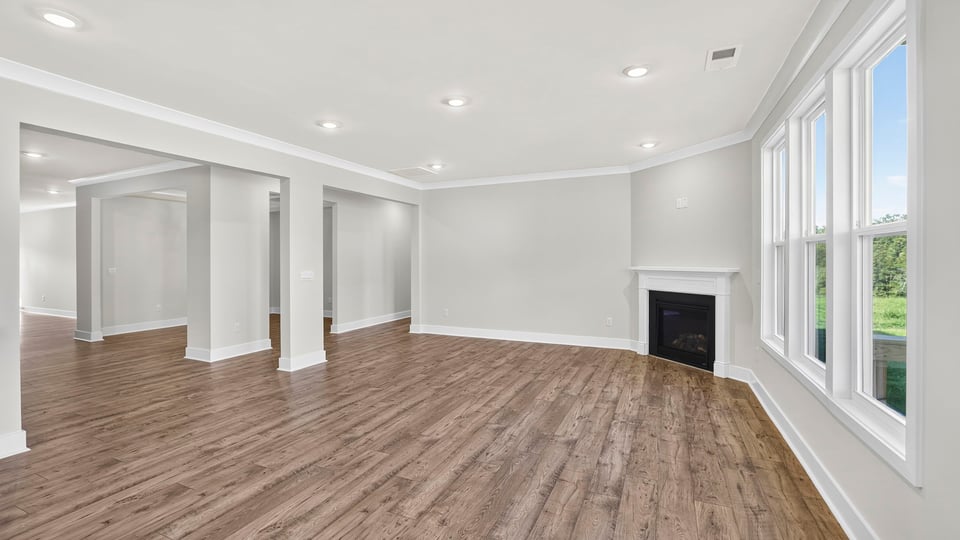 Family room with fireplace and window.